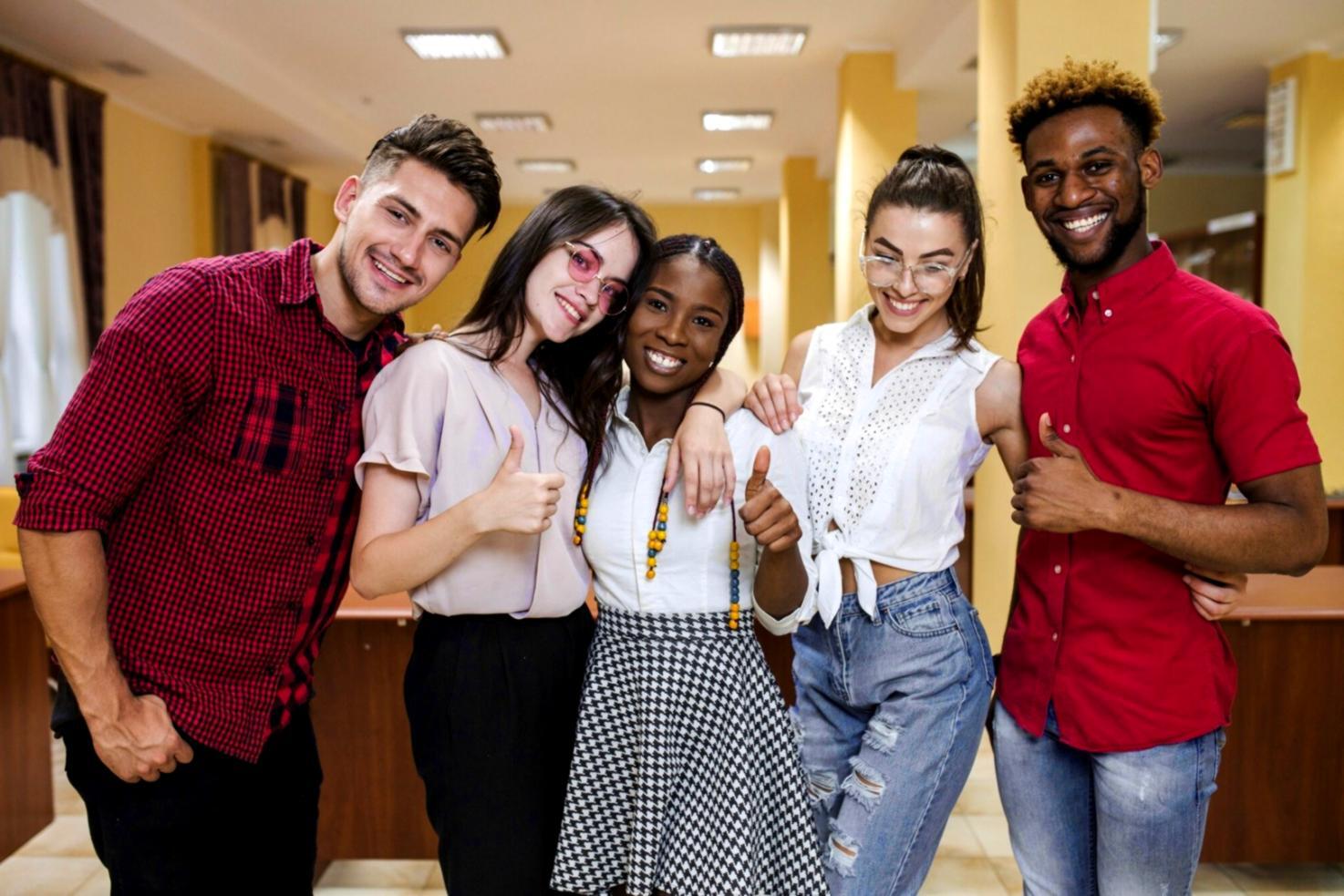 Financial analyst reviewing detailed charts and investment reports with multiple computer monitors showing market data